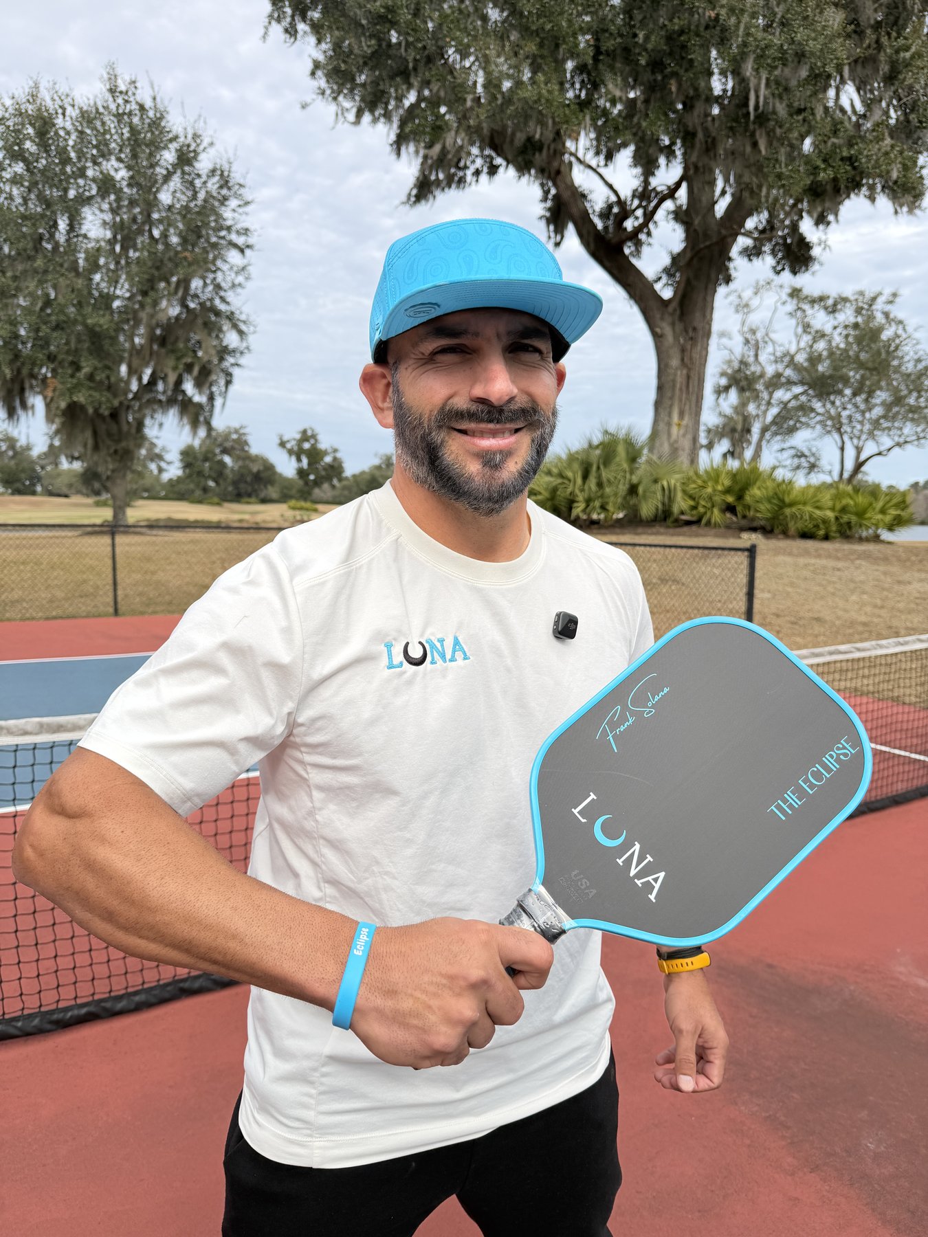 Frank Solana holding the Luna Eclipse paddle on court